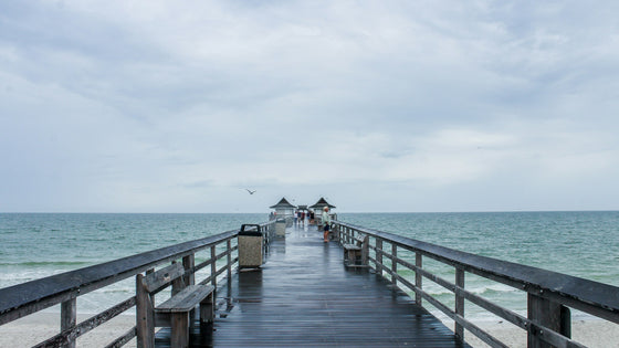 The Naples Pier stretching out over the Gulf of Mexico in Naples, Florida