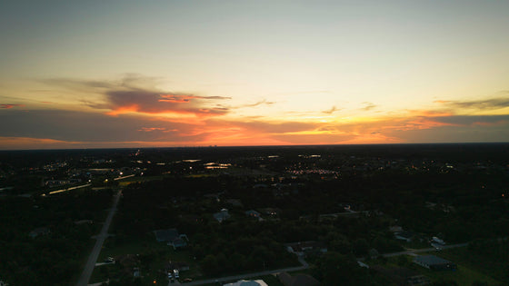 Sunset over the wide suburban landscape of Lehigh Acres, seen from above